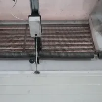 Molas de torção no eixo de um portão de garagem